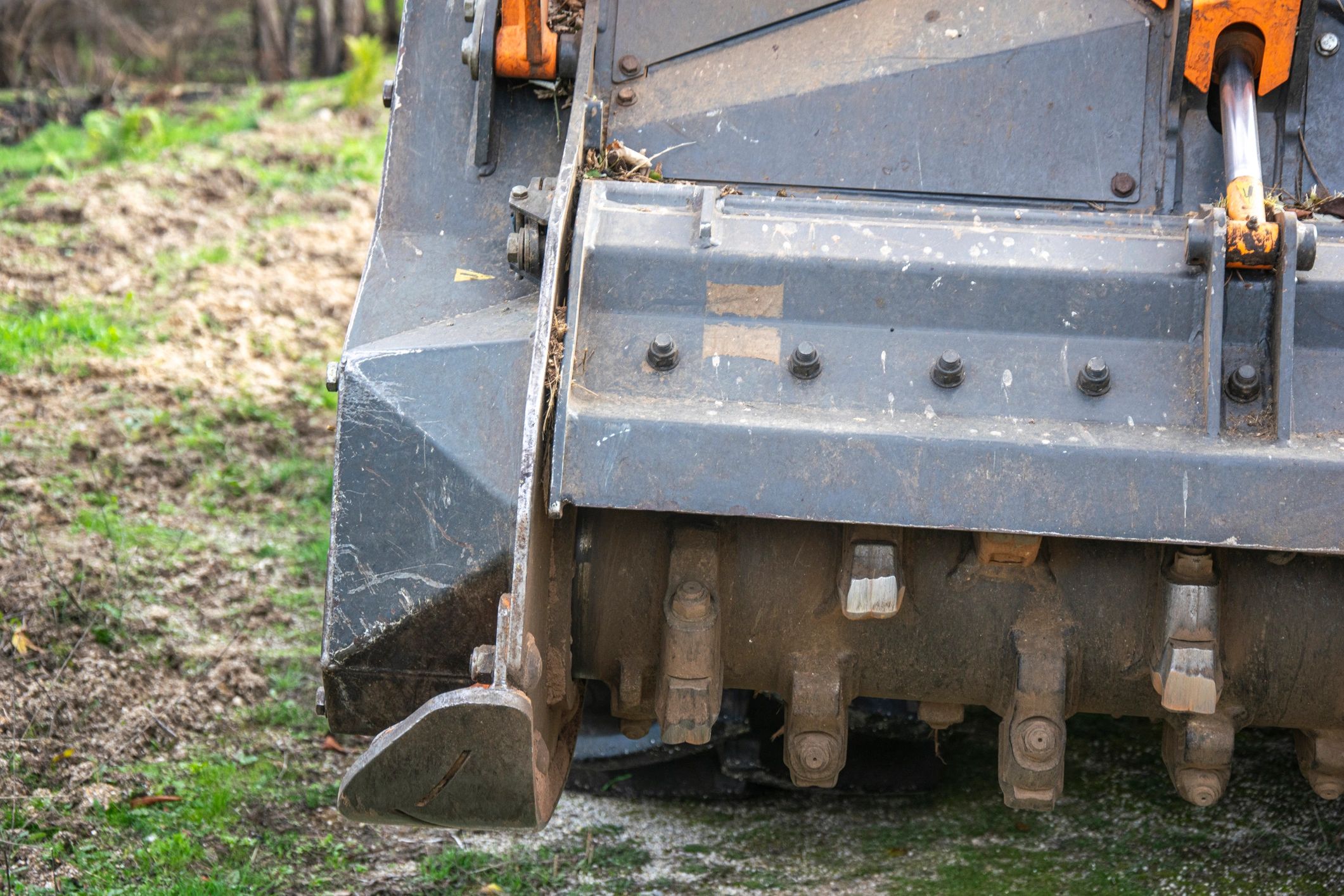 Close-up of forestry mulcher teeth used for brush clearing