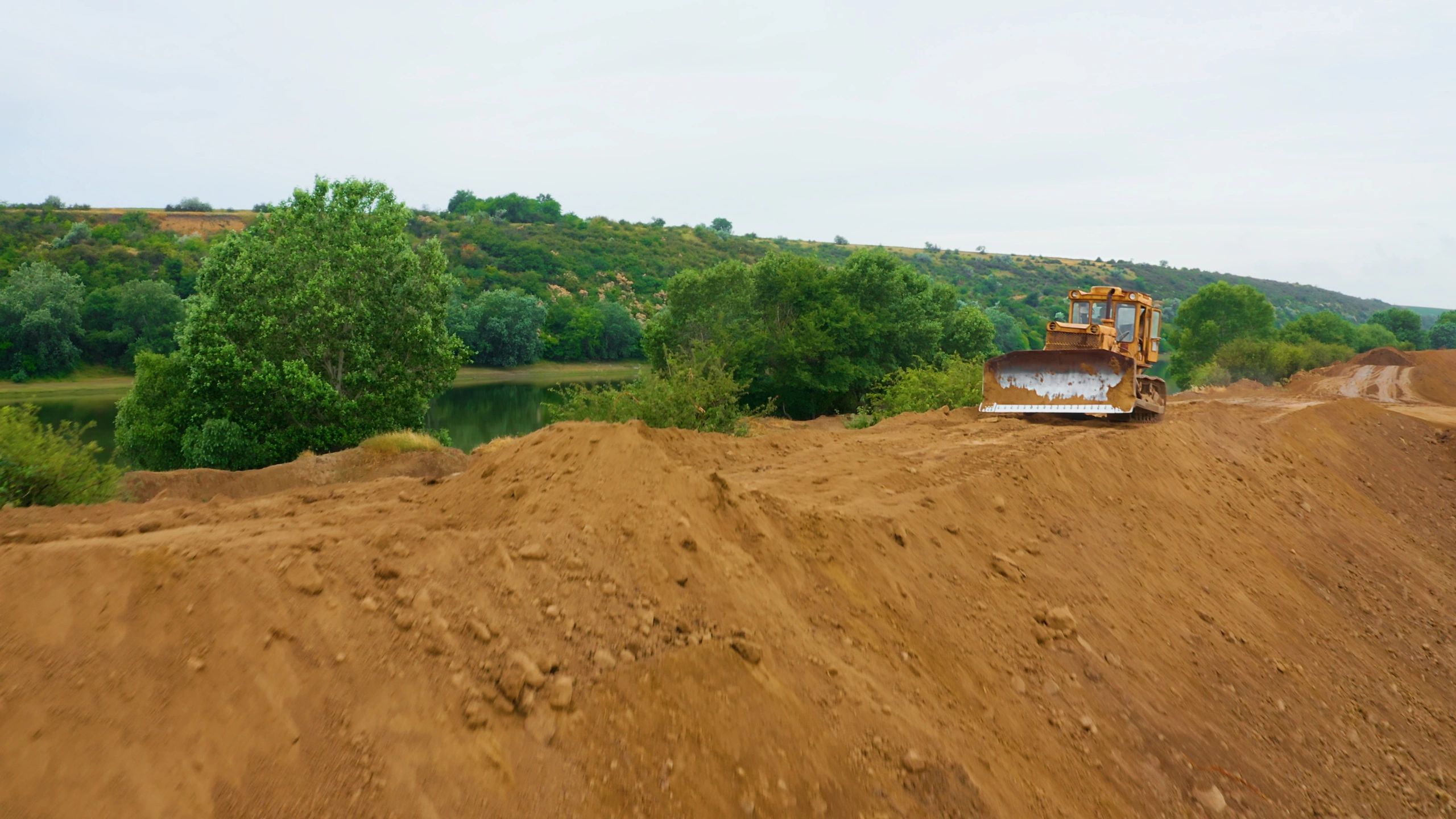 Bulldozer moving earth during site preparation
